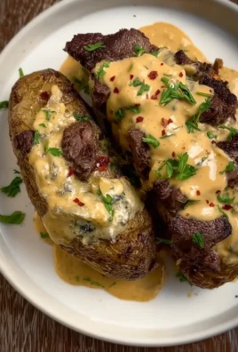 Steak Stuffed Potatoes with Parmesan Cream Sauce